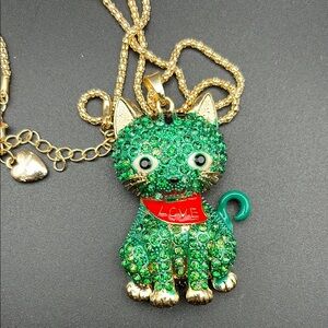 BetseyJohnson green rhinestone and gold tone kitten necklace. 2.5 inches long